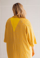 Load image into Gallery viewer, Back view of lady wearing Nage Libre jacket showing angled panels
