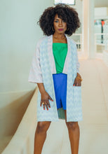 Load image into Gallery viewer, Lady wears a Nage Libre jacket: 3/4 length sleeves open robe with flat band collar and sleeves in contrasting fabric patterns
