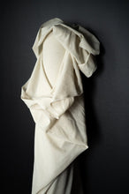 Load image into Gallery viewer, Bolt of cotton linen fabric stood against wall with fabric draped over the end
