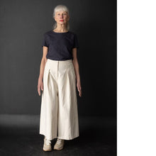 Load image into Gallery viewer, Model wears wide-leg culotte trousers with waist pleats
