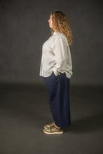 Load image into Gallery viewer, Side view of model wearing wide-leg culotte trousers
