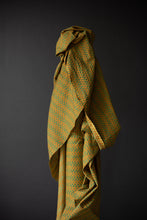 Load image into Gallery viewer, Hand block printed fabric rolled and draped on a bolt stood upright
