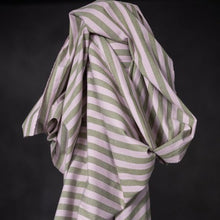 Load image into Gallery viewer, Striped, organic cotton/linen fabric with green and pink stripes on a black background
