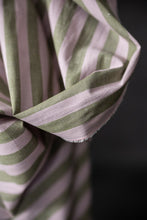 Load image into Gallery viewer, Close-up of striped, organic cotton/linen fabric with green and pink stripes on a black background
