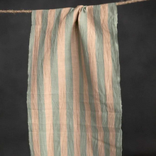 Load image into Gallery viewer, Piece of organic cotton and linen blend fabric with stripe pattern hangs over string
