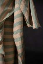 Load image into Gallery viewer, Close up of striped, organic cotton, linen fabric with pink and green pattern on a black background
