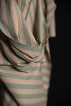 Load image into Gallery viewer, Close up of striped, organic cotton, linen fabric with pink and green pattern on a black background
