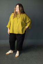 Load image into Gallery viewer, Lady wears tapered trousers with a bright coloured top
