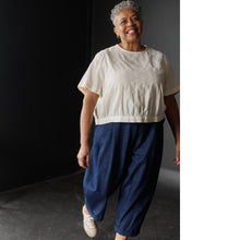 Load image into Gallery viewer, Lady wears peg trousers with turn up
