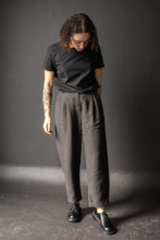 Load image into Gallery viewer, Lady wears peg trousers with front pleats and fly with turn ups
