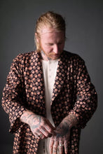 Load image into Gallery viewer, Model stands with arms raised, wearing the Sunday dressing gown open
