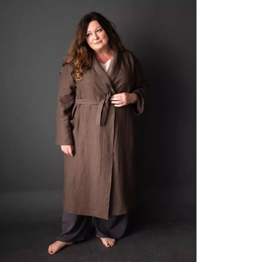 Model wears a traditional dressing gown, fastened with waist belt