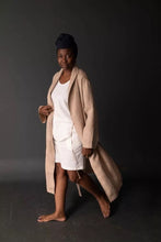 Load image into Gallery viewer, Model mid walk wears a traditional dressing gown, unfastened
