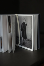 Load image into Gallery viewer, Merchant &amp; Mills book displayed stood up and open at a photograph of a model in shirtdress.
