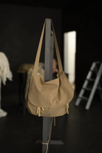 Load image into Gallery viewer, Mail bag with flap over, hung on the end of a rail.
