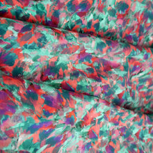 Load image into Gallery viewer, Cotton Lawn fabric with a multicoloured brushstroke effect, abstract print; fabric displayed with soft. folds
