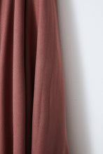 Load image into Gallery viewer, Close up of EcoVero Viscose Crepe fabric hanging with fluid drape
