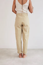 Load image into Gallery viewer, Back view of model wearing Worker Trousers, shows patch large patch pockets at hip level
