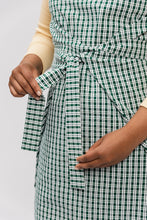 Load image into Gallery viewer, Close up view of wrap ties at waist level of Lilja Pinafore
