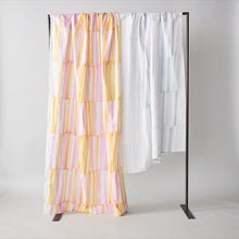 Load image into Gallery viewer, Organic cotton double gauze fabric sheets hang over rail with bold pen-strokes design pattern in two different colours
