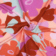 Load image into Gallery viewer, Eco Viscose Fabric with a bold, retro-style floral pattern, displayed with a central swirl showing soft drape
