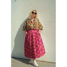 Load image into Gallery viewer, Model wears a collared blouse made with Shape Shifter Viscose Fabric
