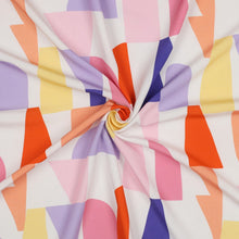 Load image into Gallery viewer, Eco Viscose fabric with abstract geometric pattern of various irregular shapes, displayed with central swirl shows soft drape
