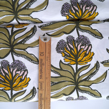 Load image into Gallery viewer, Manifesto EcoVero Viscose fabric displayed with wooden ruler next to a flower stem print
