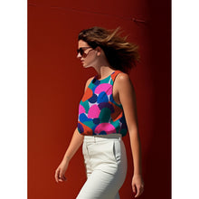 Load image into Gallery viewer, Model wears a sleeveless top, made with the Rockpool Lavender EcoVero Viscose Fabric
