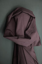 Load image into Gallery viewer, Bolt of Bramble colour organic cotton and Hemp fabric leant against the wall.
