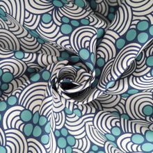 Load image into Gallery viewer, Organic Cotton fabric with abstract waves and bubbles print, fabric shown with central swirl
