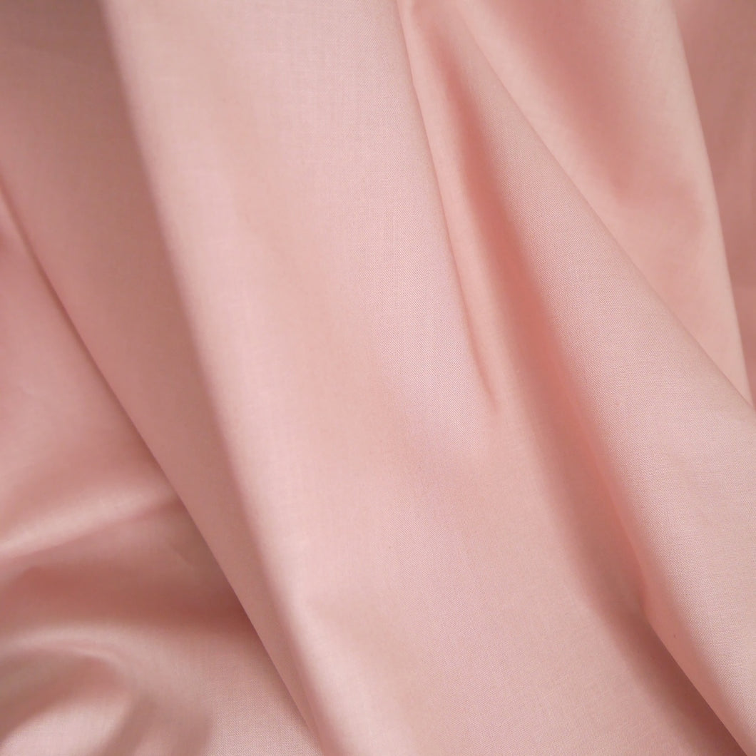 Organic Cotton Poplin Fabric hangs in drape