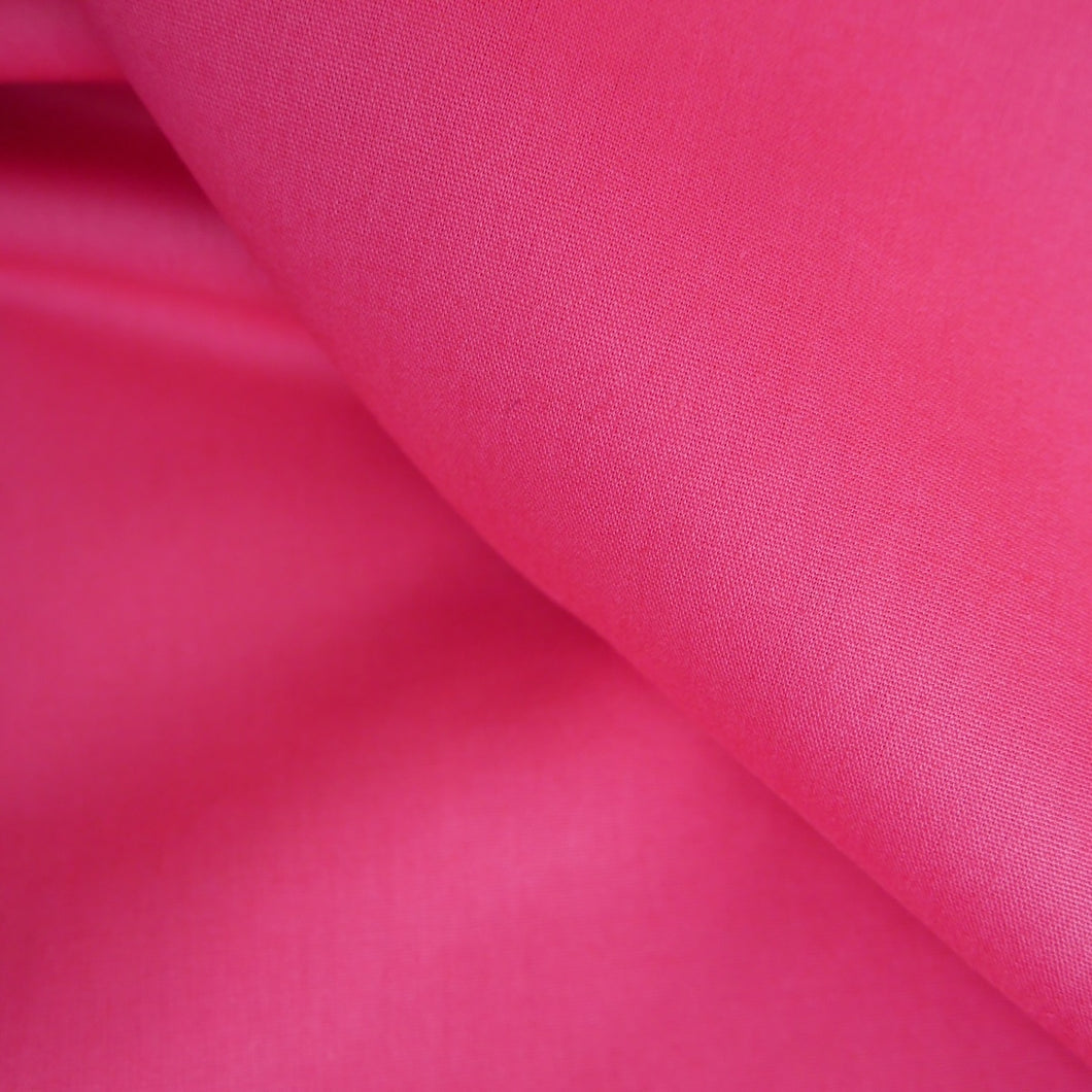 Organic cotton poplin fabric shown in a soft fold