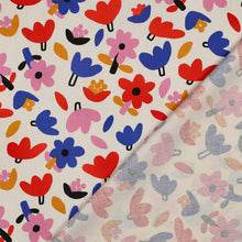 Load image into Gallery viewer, Bold floral pattern print on organic cotton poplin fabric, shown folded with reverse side on display
