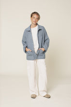 Load image into Gallery viewer, Lady stands with hands in front patch pockets on jacket. Jacket worn open, a slightly oversized style fit
