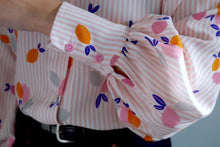 Load image into Gallery viewer, Puffy, gathered sleeve into cuff with two buttons
