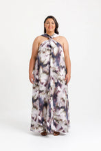 Load image into Gallery viewer, Lady stands wearing dress with crossover halter neck straps
