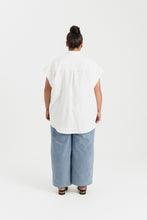 Load image into Gallery viewer, Back view of lady wearing a short sleeve shirt, hem at thigh level
