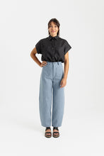 Load image into Gallery viewer, Lady wears barrel leg style trousers with patch pockets at hip level
