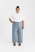 Load image into Gallery viewer, Lady wears straight leg trousers with utilitarian-style patch pockets at hip level
