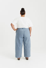 Load image into Gallery viewer, Back view of lady wearing straight leg trousers with patch pockets at hip level
