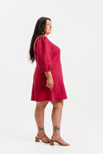 Load image into Gallery viewer, Side profile of lady wearing a long puff sleeve dress with bias cut skirt, knee length
