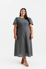 Load image into Gallery viewer, Lady wears a short sleeve dress with bias cut skirt, midi length
