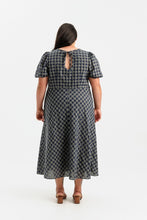 Load image into Gallery viewer, Back view of lady wearing a short sleeve dress with keyhole back detail, with bias cut skirt, midi length
