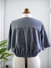 Load image into Gallery viewer, Back view of gathered yoke blouse on mannequin in Sandwashed Lyocell Fabric

