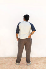 Load image into Gallery viewer, Back view on model wearing Rambler Pants, right hand in back patch pocket
