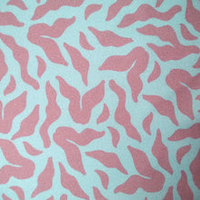 Load image into Gallery viewer, Close up of EcoVero Viscose Twill fabric showing &#39;Evolve&#39; design print of scattering leaves
