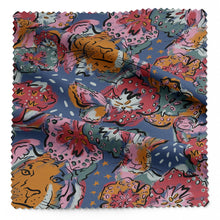 Load image into Gallery viewer, Find Your Tribe Organic Cotton Fabric shown with soft folds in drape, with a multicoloured pattern of outlines of tigers, hares, snails and flower heads
