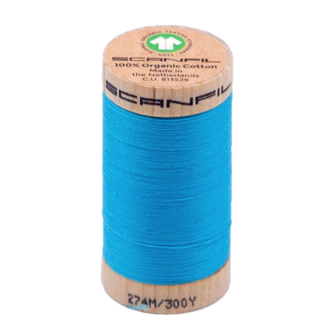 Wooden spool of organic cotton sewing thread