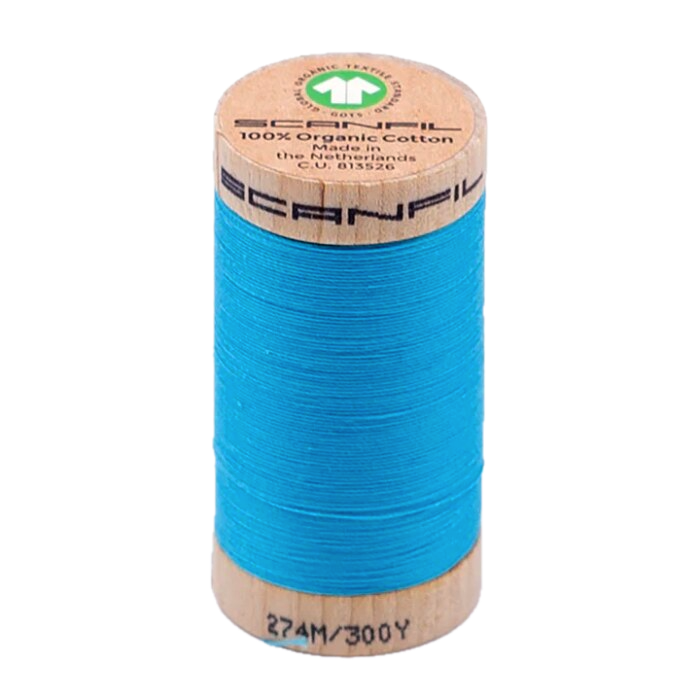 Wooden spool of organic cotton sewing thread